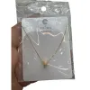 A golden cylindrical small diamond pendant necklace with a white card attached to a transparent bag Item Picture